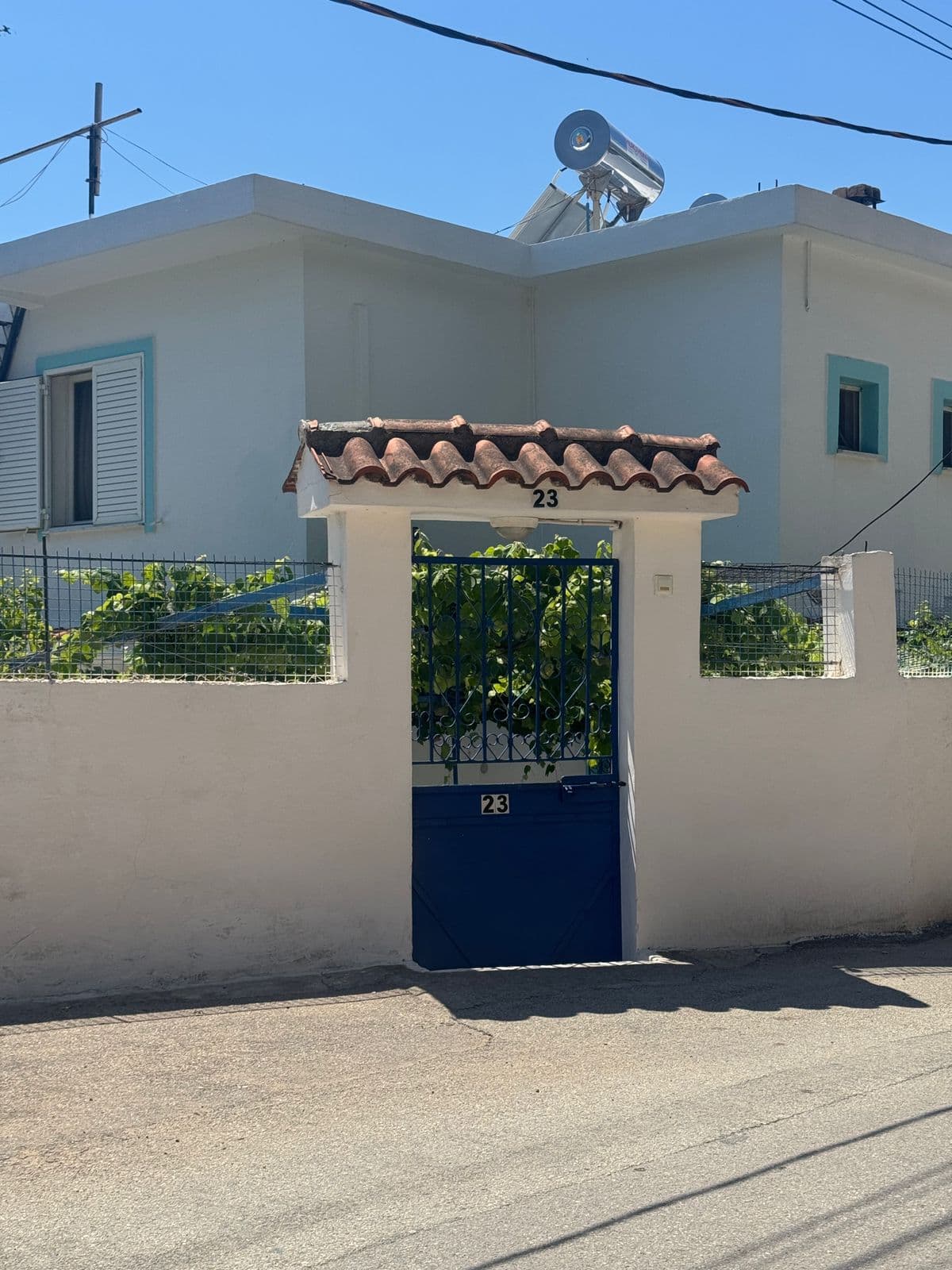 Kristaqi Rooms entrance — blue gate, number 23